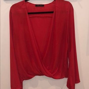 Red open blouse with wide sleeves
